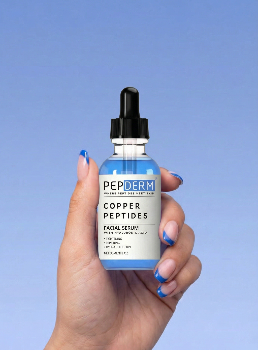 Hand holding a bottle of PEPTDERM Copper Peptides Facial Serum against a blue background